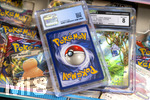 05.08.2026, Deutschland, Bayern, Pokemon-Sammelkarten, eine Teenagerin sammelt begeistert Pokemon-Karten.  