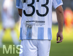 22.08.2026, Fussball DFB-Pokal 2026/27, 1.Runde, TSV 1860 München - Holstein Kiel, im Stadion an der Grünwalderstrasse in München, Lasse Faßmann (TSV 1860 München) auf dem Trikot-Rücken sind die Namen des Terroranschlages im OEZ München aufgedruckt, an den durch das Sondertrikot erinnern soll. 