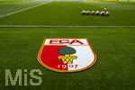 30.08.2026, Fussball Bundesliga 2026/2027, 1.Spieltag, FC Augsburg - FC Schalke 04, in der WWK-Arena Augsburg, FCA-Vereinswappen liegt als Teppich vor dem Spielfeld aus. 
