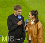 27.09.2026, Fussball UEFA Nations-League 2026/2027, 2.Spieltag, Deutschland - Griechenland, in der WWK-Arena Augsburg, v.li: Bundestrainer Jürgen Klopp (Deutschland) bei Esther Sedlaczek am BR-ARD Mikrofon am Spielfeldrand 