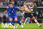 01.10.2026, Fussball UEFA Nations-League 2026/2027, 3.Spieltag, Deutschland - Serbien, in der Allianz-Arena München. v.l. Luka Jovic (Serbien) gegen Waldemar Anton (Deutschland) 