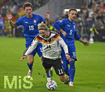 01.10.2026, Fussball UEFA Nations-League 2026/2027, 3.Spieltag, Deutschland - Serbien, in der Allianz-Arena München. v.l. Stefan Dzodic (Serbien), Nick Woltemade (Deutschland) und Nemanja Maksimovic (Serbien) 