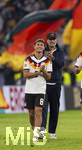 01.10.2026, Fussball UEFA Nations-League 2026/2027, 3.Spieltag, Deutschland - Serbien, in der Allianz-Arena München. v.li: Tom Bischof (Deutschland), Bundestrainer Jürgen Klopp (Deutschland), Mika Baur (Deutschland), nach dem Spiel bei der Ehrenrunde, 