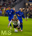 01.10.2026, Fussball UEFA Nations-League 2026/2027, 3.Spieltag, Deutschland - Serbien, in der Allianz-Arena München. v.li: Stefan Dzodic (Serbien), Nick Woltemade (Deutschland), Nemanja Maksimovic (Serbien) 