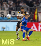 01.10.2026, Fussball UEFA Nations-League 2026/2027, 3.Spieltag, Deutschland - Serbien, in der Allianz-Arena München. Malick Thiaw (Deutschland) gegen Mihajlo Cvetkovic (Serbien) 