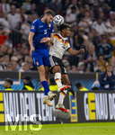 01.10.2026, Fussball UEFA Nations-League 2026/2027, 3.Spieltag, Deutschland - Serbien, in der Allianz-Arena München. von links:  Strahinja Pavlovic (Serbien) gegen Bambase Conte (Deutschland) 