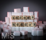 13.10.2026, Thema Zuckersteuer für Softgetränke. Studioaufnahme mit Würfelzucker und Schriftzug ZUCKERSTEUER.