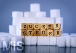 14.10.2026, Thema Zuckersteuer für Softgetränke. Studioaufnahme mit Würfelzucker und Schriftzug ZUCKERSTEUER.  Die Bundesregierung hat sich im Streit um die Zuckersteuer für Getränke geeinigt, Der Kompromiss sieht eine zweistufige Steuer und Ausnahmen für kleinere Hersteller vor. So soll ab dem 1. Juli 2027 ein Steuersatz von 26 Cent auf gesüßte Getränke mit einem Zuckergehalt ab 5 Gramm pro 100 Milliliter erhoben werden. Bei einem Zuckergehalt von 8 Gramm pro 100 Milliliter soll der Satz 32 Cent betragen.